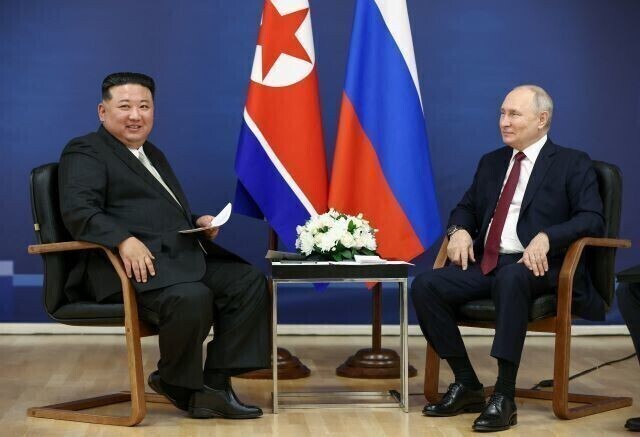 North Korean leader Kim Jong-un and Russian President Vladimir Putin sit together during their meeting at the Vostochny Cosmodrome in Russia’s Far East on Sept. 12, 2023. (Yonhap)