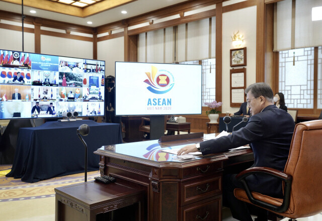 South Korean President Moon Jae-in partakes in a digital ASEAN Plus Three summit to discuss responses to COVID-19 at the Blue House in April. (provided by the Blue House)