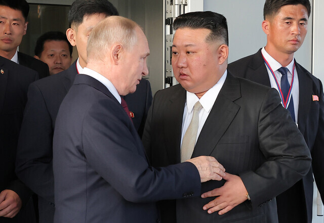 Russian President Vladimir Putin speaks to North Korean leader Kim Jong-un during the latter’s visit to the Russian Far East for a summit on Sept. 19, 2023. (KCNA/Yonhap)