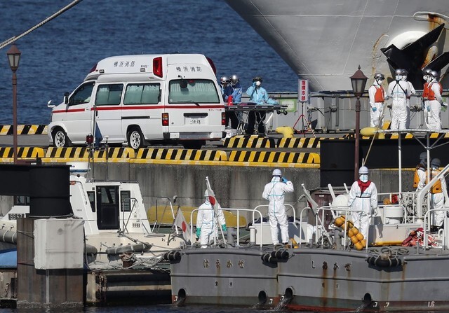 Medical workers and the Japanese Coast Guard prepare for the arrival the Diamond Princess cruise ship, where at least 10 novel coronavirus cases have been confirmed, in Yokohama, Japan, on Feb. 5. (EPA/Jiji Press)