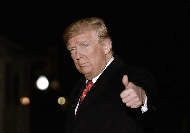 US President Donald Trump gives a thumbs up to reporters before returning to the White House in Washington DC after visits to Detroit and Nashville on Mar. 15. (Yonhap News)