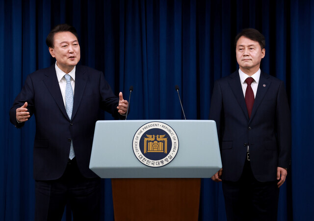 President Yoon Suk-yeol (left) answers questions from reporters after introducing his new senior secretary for civil affairs, former Ministry of Justice Vice Minister Kim Ju-hyeon at the presidential office in Seoul on May 7, 2024. (Yonhap)
