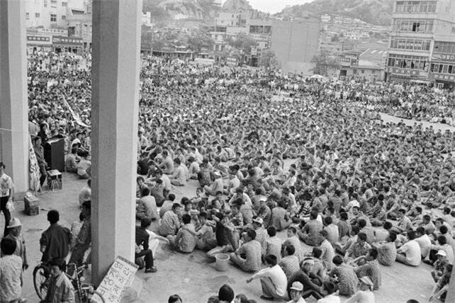 The photograph, by American journalist Norman Knute Thorpe, shows protesters gathered in front of Mokpo Station in Mokpo, South Jeolla Province, on May 24, 1980.