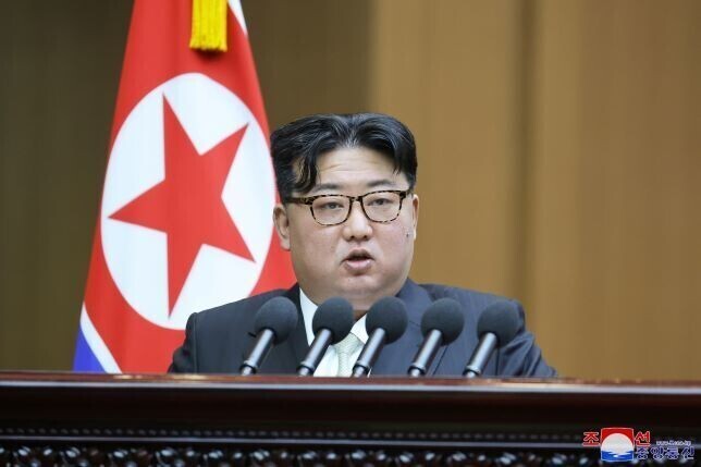 North Korean leader Kim Jong-un gives a speech at a Supreme People’s Assembly on Jan. 15 in which he defines the South as the “invariable principal enemy” of the North. (KCNA/Yonhap)