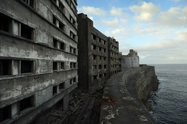 Hashima Island, also known as Battleship Island, was one site where forcibly mobilized Koreans labored for 12-16 hours per day without adequate pay. Pictured are the dormitories on the island where Koreans lived. (courtesy of Lee Jae-gap)