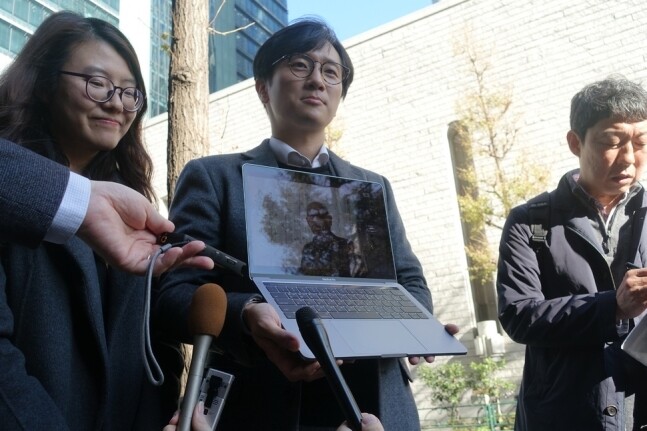 Attorneys representing South Korean victims of forced labor relay a video message from Lee Chun-sik (95)