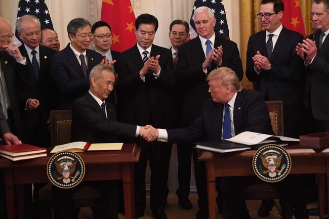 US President Donald Trump shakes hands with Chinese Vice Premier He after signing the US-China phase one trade deal at the White House on Jan. 15. (AFP)