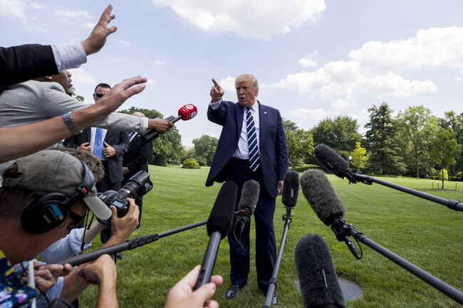 US President Donald Trump talks to reporters in front of the White House on July 19. (AP/Yonhap News)