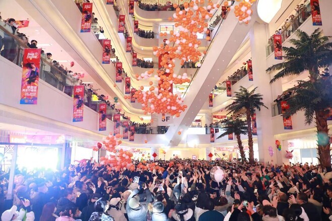 People attend a New Year’s Eve event at a shopping mall in Shijiazhuang, China, on Dec. 31. (Xinhua/Yonhap)
