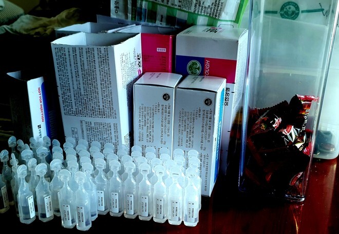 An elderly South Korean man in his 70s has to take piles of medication for a respiratory ailment.