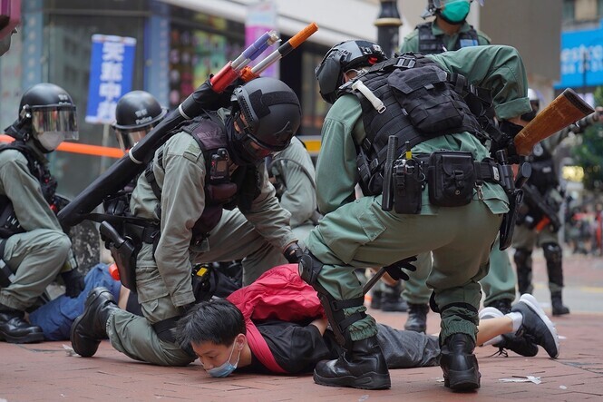 Police arrest a person protesting the enactment of the National Security Law in Hong Kong on May 24, 2020. (AP/Yonhap)
