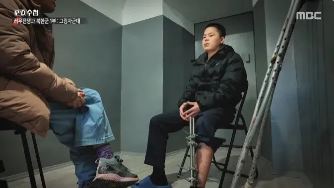 Still of Paik speaking to MBC’s “PD Note.”