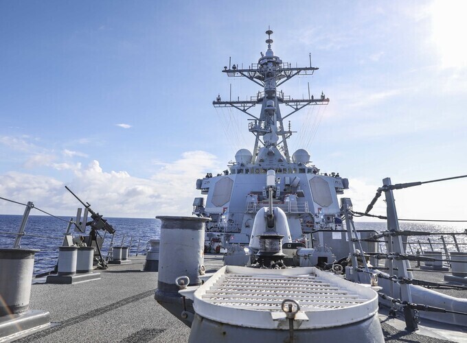 Part of the US 7th fleet, the guided-missile destroyer USS Benfold transits the South China Sea while conducting a freedom of navigation operation. (provided by the US Navy)
