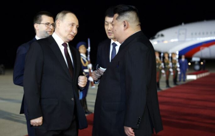 Russian President Vladimir Putin is welcomed to North Korea by leader Kim Jong-un at the Pyongyang Sunan International Airport in the early hours of June 19, 2024. (EPA/Yonhap)