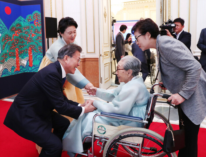 President Moon Jae-in greets a former comfort woman
