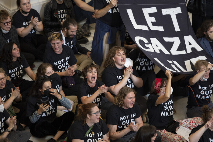 Demonstrators calling for a ceasefire in Gaza occupy the Cannon House Office Building at the US Capitol in Washington on Oct. 18. (AP/Yonhap)