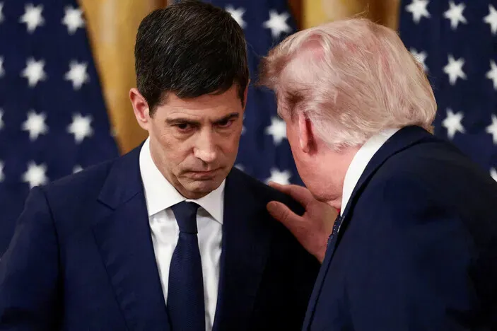 US President Donald Trump speaks to Fed Chair Kevin Warsh at an event at the White House in May 2026. (Reuters/Yonhap)