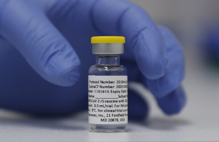 A vial of the Phase 3 Novavax coronavirus vaccine is seen ready for use in the trial at St. George's Hospital in London, England. (AP/Yonhap News)