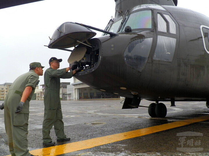 Taiwanese soldiers inspect a military aircraft at an unspecified base on Oct. 22. (EPA/Yonhap News)