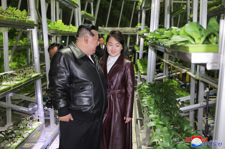 North Korea’s state-run KCNA reported on March 16, 2024, that leader Kim Jong-un had attended the ribbon-cutting of the Kangdong General Greenhouse Farm with his daughter Ju-ae on March 15. (KCNA/Yonhap)