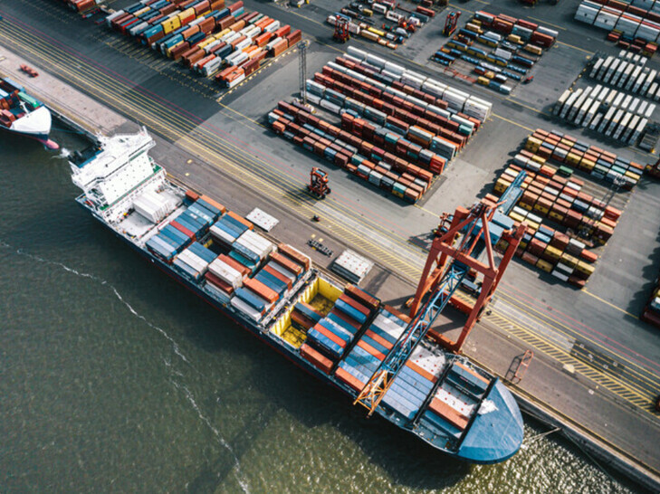 Freight containers are loaded onto a ship at a port. (Getty Images Korea)