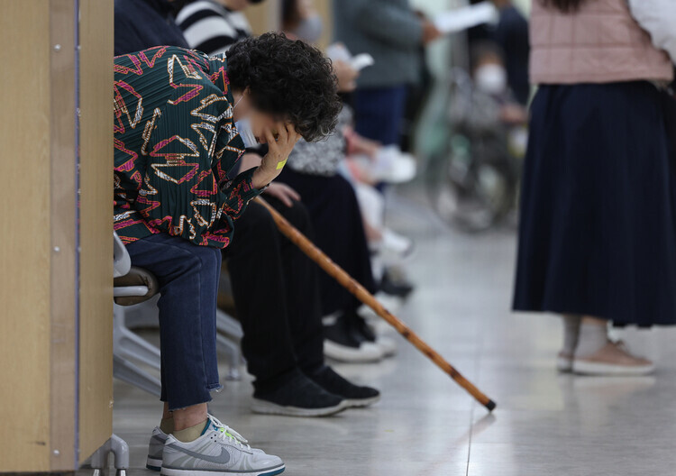 Patients sit in a waiting room at a university-affiliated hospital in Daegu, in southwestern Korea, on April 9, 2024. (Yonhap)