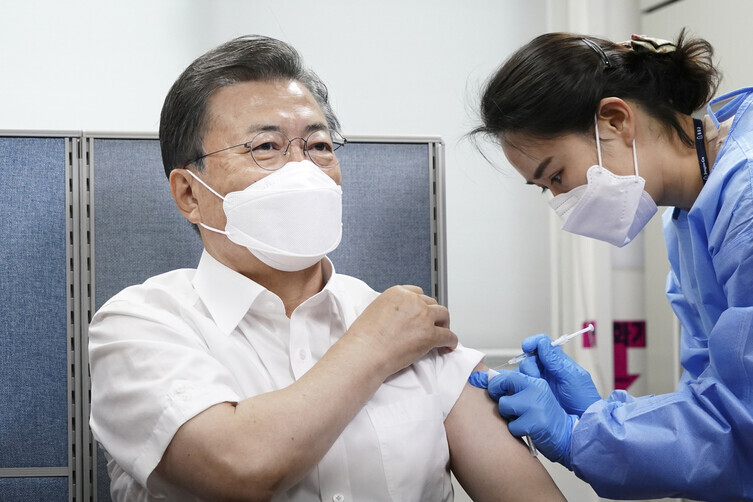 South Korean President Moon Jae-in receives AstraZeneca’s COVID-19 vaccine at a public health center in Seoul on Tuesday. (Blue House photographers’ pool)