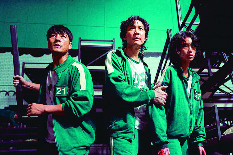 A still from the Netflix series “Squid Game” showing three of the main characters