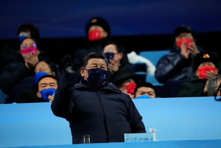 Chinese leader Xi Jinping waves his hand while attending the opening ceremony of the Beijing Winter Olympics at the National Stadium on Feb. 4. (Reuters/Yonhap News)