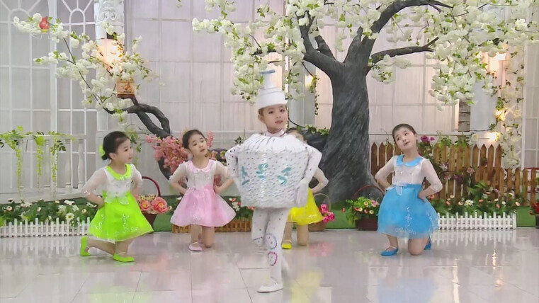 Students at a preschool in Pyongyang perform a dance about sticking to disease control measures on May 28. (Yonhap News)