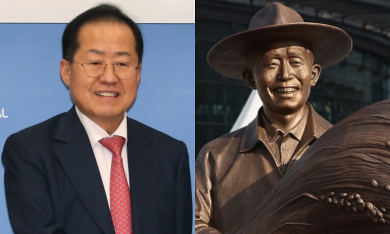 홍준표 전 대구시장과 동대구역 광장에 설치된 박정희 전 대통령 동상. 연합뉴스