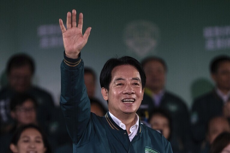 Lai Ching-te, the presidential candidate for Taiwan’s Democratic Progressive Party, waves to supporters after winning the election the night of Jan. 13. (AP/Yonhap)