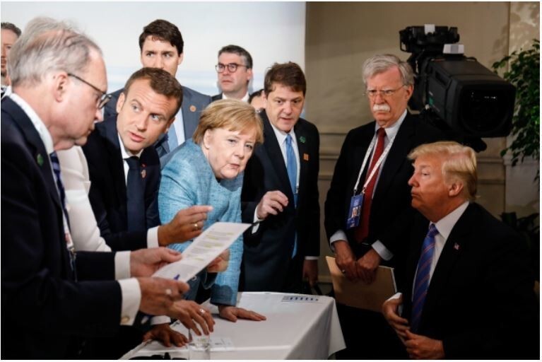 Global leaders including German Chancellor Angela Merkel, French President Emmanuel Macron, and US President Donald Trump during the G7 summit in Quebec City, Canada, on June 9, 2018. (AP/Yonhap News)