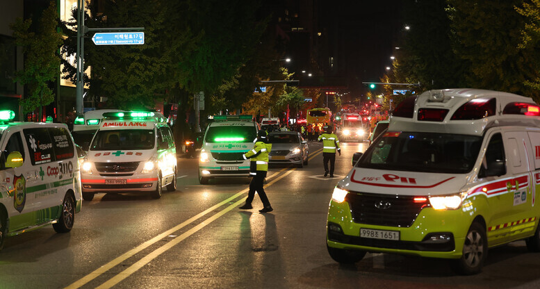 First responders can be seen arriving in Itaewon in the early hours of Oct. 30, following a disaster that took the lives of over 150 people. (Yonhap)