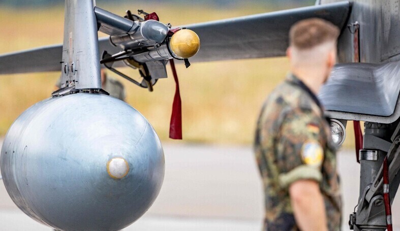 A German soldier gazes at an Iris-T missile at an air base in Jagel, southern Germany, in Jun 2023. (AFP/Yonhap)