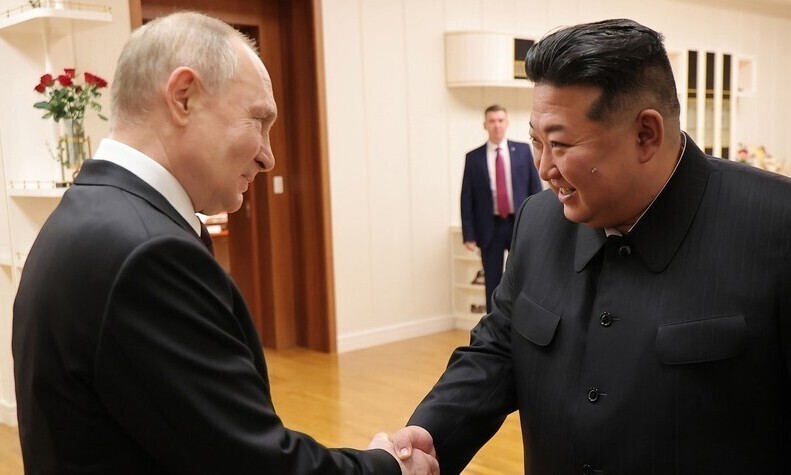 Russian President Vladimir Putin shakes hands with North Korean leader Kim Jong-un ahead of their summit in Pyongyang on June 19, 2024. (KCNA/Yonhap)