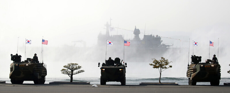 Marines from South Korea and the US ride assault amphibious vehicles and wheeled armored vehicles in a simulated landing operation during the commencement ceremony for the 77th graduating class of the Republic of Korea Naval Academy on March 10 in Changwon, South Gyeongsang Province. (presidential office pool photo)