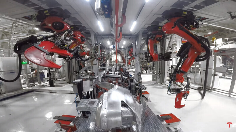 Tesla’s Model X being built by robots. (Screenshot from Tesla’s YouTube channel)