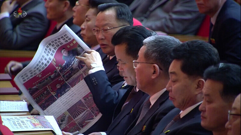 In this photo released by North Korea’s state-run Korean Central News Agency, attendants at the Eighth Workers’ Party of Korea Congress read the Rodong Sinmun, the newspaper of the WPK Central Committee, at the April 25 House of Culture in Pyongyang, on Jan. 6. (Yonhap News)