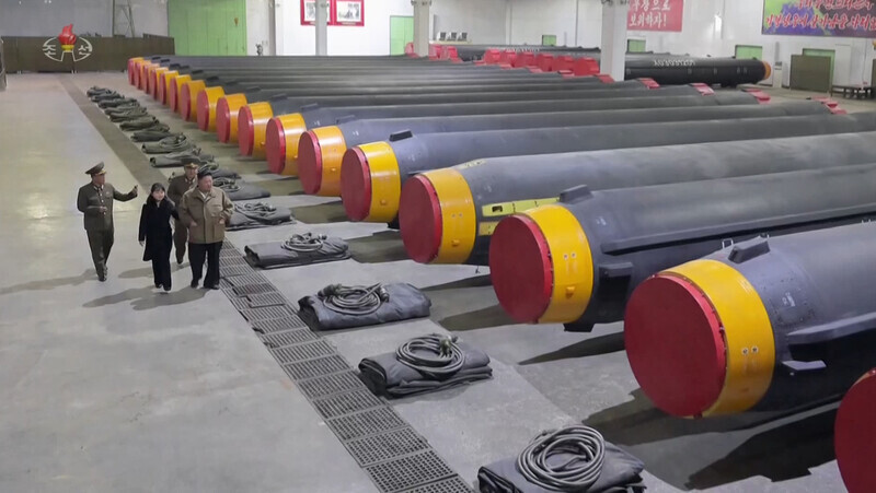 North Korean leader Kim Jong-un takes a tour of a facility housing Hwasong-12 intermediate-range ballistic missiles. (Yonhap)
