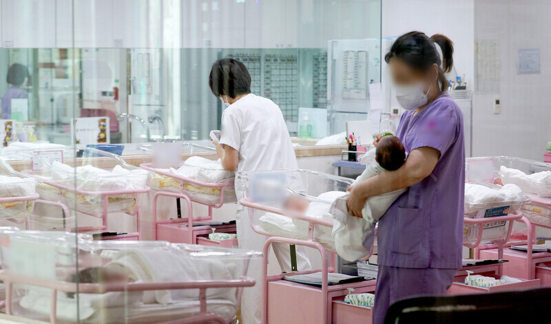 Nurses care for newborns in the maternity ward at a postpartum care facility in Seoul on Feb. 28, 2024. (Yonhap)