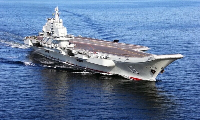 China’s first aircraft carrier, christened Liaoning, uses a ski-jump jet launcher rather than the catapult used by US carriers. (Xinhua/Yonhap News)