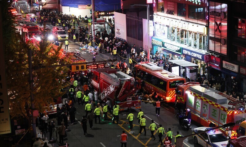 Fire brigade members can be seen in Itaewon on Oct. 29, the night that a crowd surge turned deadly, killing at least 154. (Yonhap)