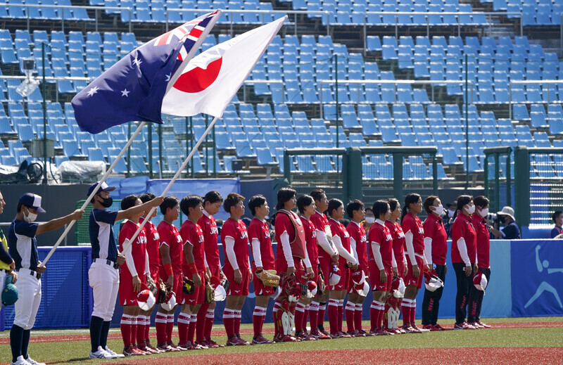 The Tokyo Olympics kicked off Wednesday with a game between the Australian and Japanese women’s softball teams. (AP/Yonhap News)
