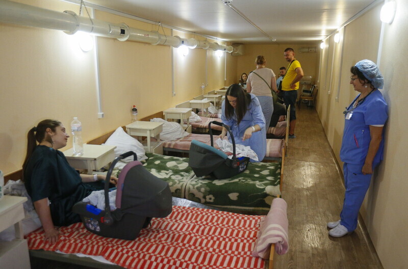 Women with children take refuge in an air raid shelter in Odesa, Ukraine, on Aug. 22. (EPA/Yonhap News)