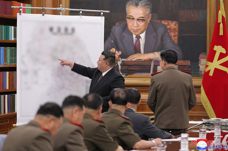 On Aug. 10 the state-run Rodong Sinmun reported that Kim Jong-un, the leader of North Korea, had reached an “important conclusion on further stepping up the war preparations of the KPA in an offensive way,” during a meeting of the WPK Central Military Commission on Aug. 9. The article ran with photos of Kim gesturing toward the general area of Seoul on a map of the Korean Peninsula. (KCNA/Yonhap)