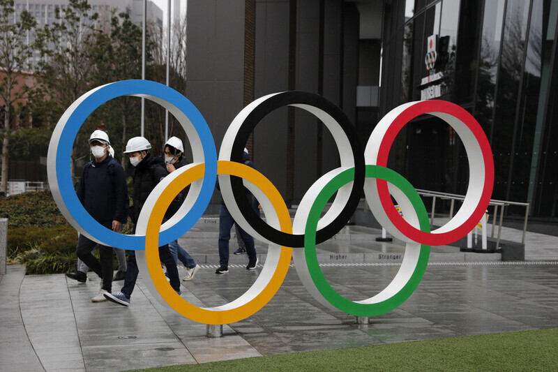 An Olympic logo installed in front of the Japan National Stadium. (AP/Yonhap News)