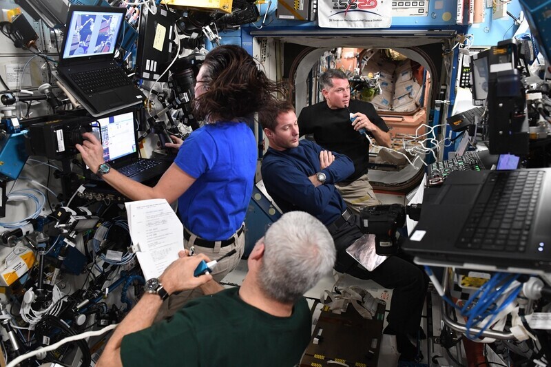 In this image American astronaut Megan McArthur posted on Twitter, astronauts are performing their duties at the International Space Station. (Twitter screenshot)
