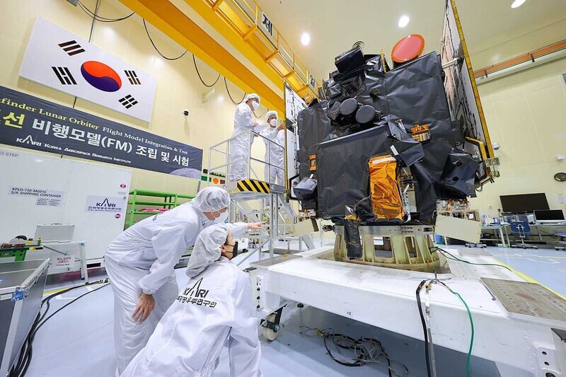 Engineers at KARI carry out final checks on South Korea’s first lunar orbiter, the Danuri, ahead of its launch scheduled for August. (provided by KARI)