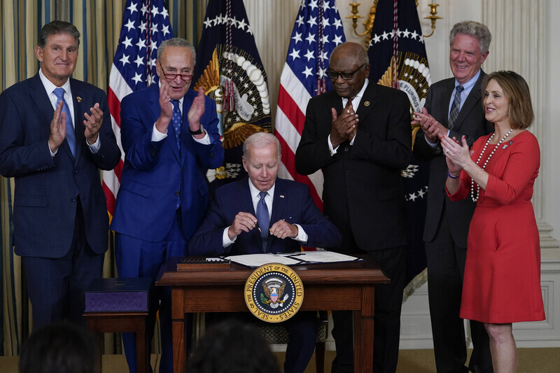 President Joe Biden of the US signs the Inflation Reduction Act into law on Sept. 16 at the White House in Washington. (Yonhap)